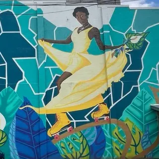Woman in a yellow dress on roller skates